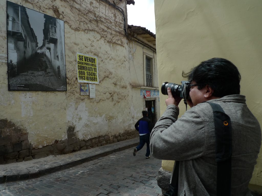 Julio Pantoja photographing exhibit. Photo: Silvia Spitta, 2014.